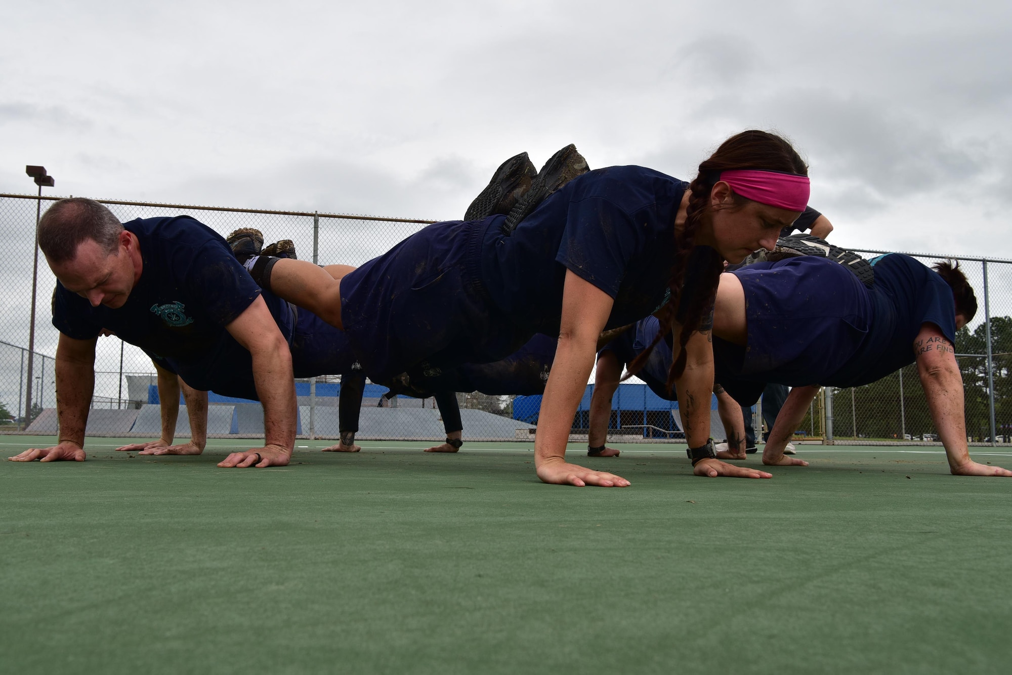 Fire Department volunteers perform a team pushup.