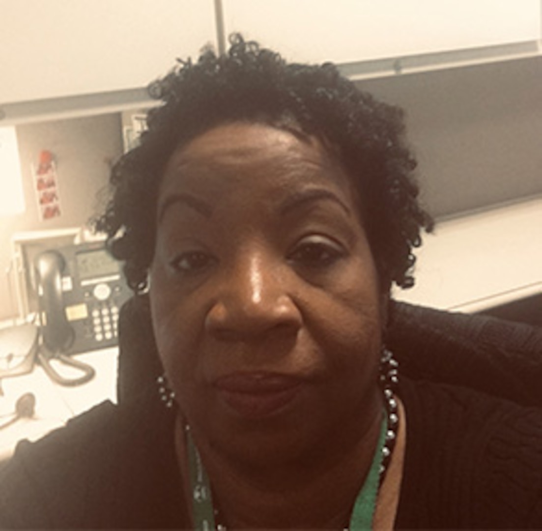 A lady siting at her desk