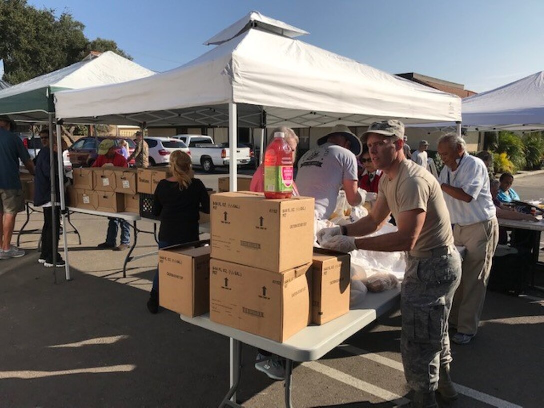 Volunteers sort food during an event with the Village Chapel Food Bank Nov. 16, 2018, at Vandenberg Village, Calif.