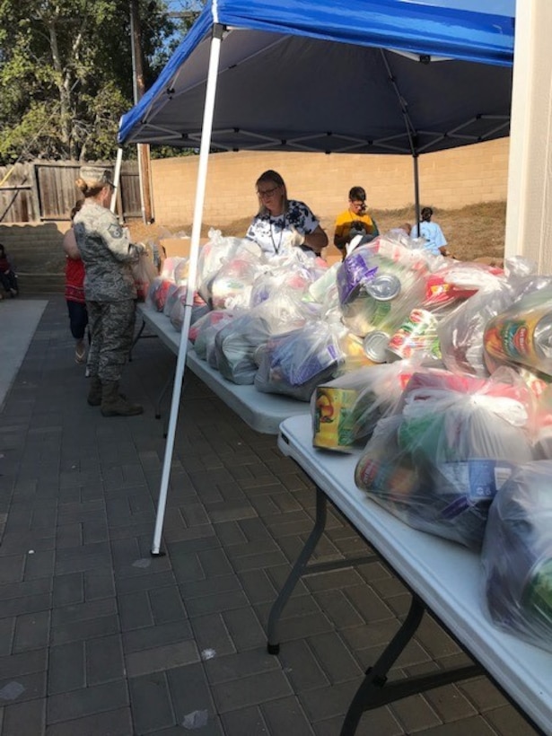 Volunteers sort bags of food with the Village Chapel Mobile Food Bank Nov. 18, 2018, at Vandenberg Village, Calif.