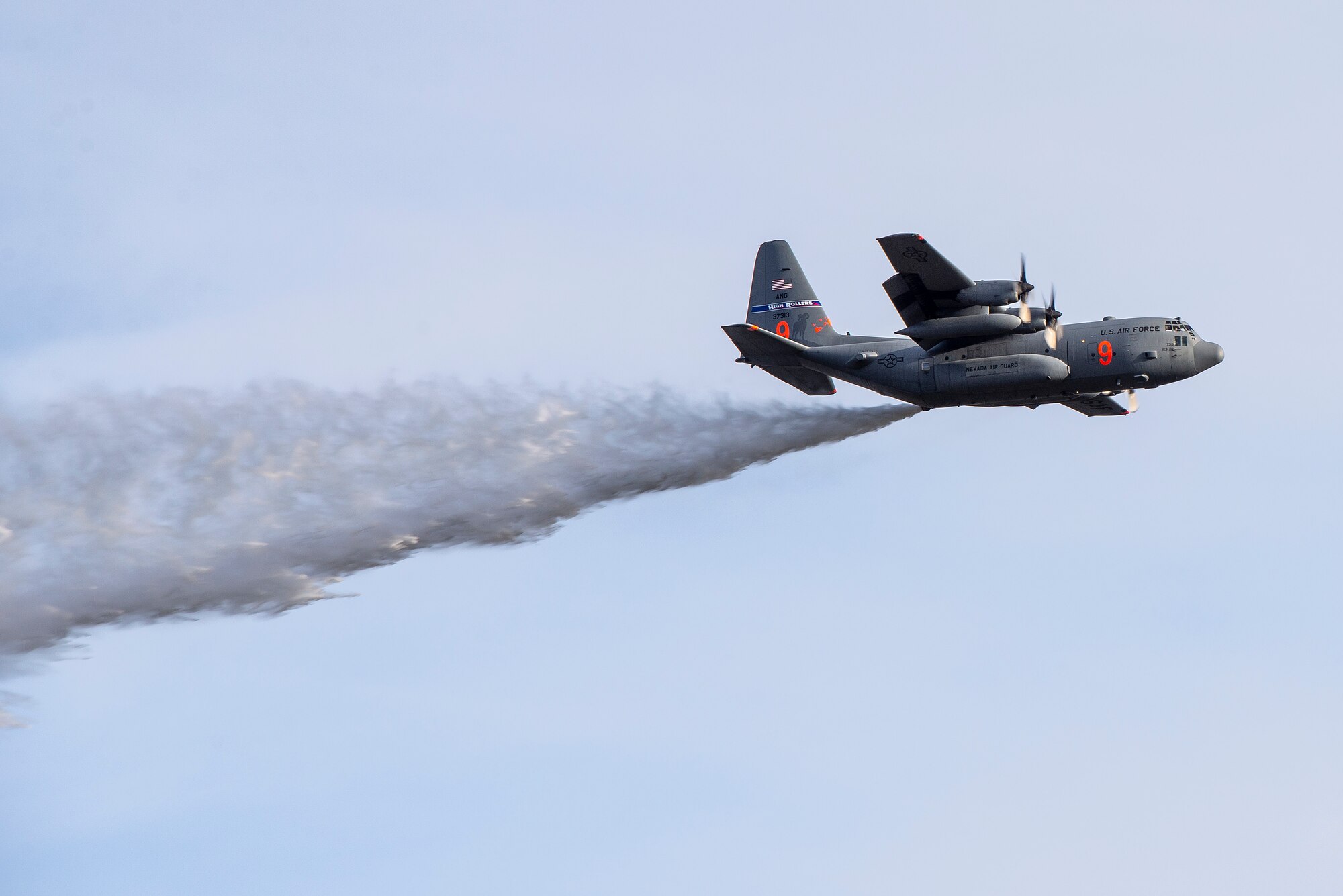 Air National Guardsmen drop water from a MAFF