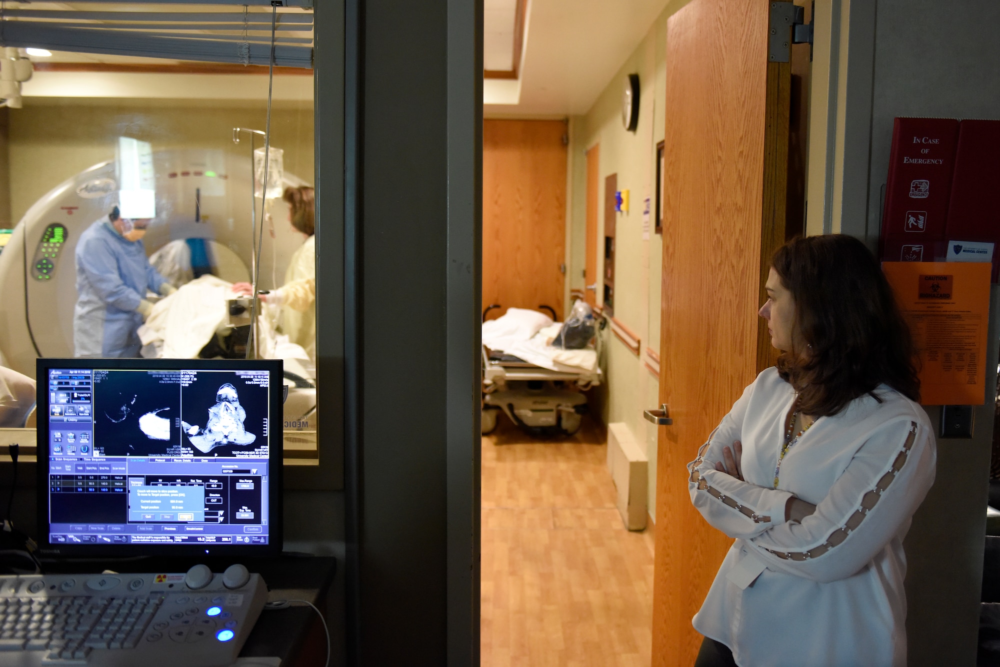 U.S. Air Force Captain Stephanie Smiddy, the infection and immunization officer-in-charge at the 180th Fighter Wing, Ohio Air National Guard, observes a cancer treatment, April 8, 2019, at the University of Toledo Medical Center where she works as the head research nurse for the precision oncology department at the Eleanor N. Dana Center. Smiddy provides care for patients undergoing experimental immunotherapy treatments in the research program. (U.S. Air National Guard photo by Staff Sgt. Shane Hughes)