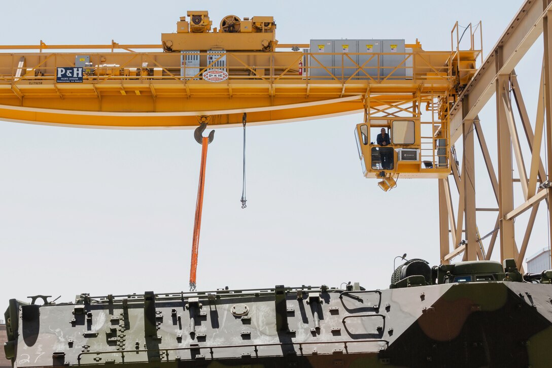 Gerald Miles, senior crane operator, has maneuvered the 75-ton crane overproduction Plant Barstow’s crane way for more than 35 years on Marine Corps Logistics Base Barstow’s Yermo Annex, California. Miles is a veteran of two combat tours overseas and retired from the Marine Corps with 20 years of honorable service as a master gunnery sergeant. (U.S. Marine Corps photo by Jack J. Adamyk)
