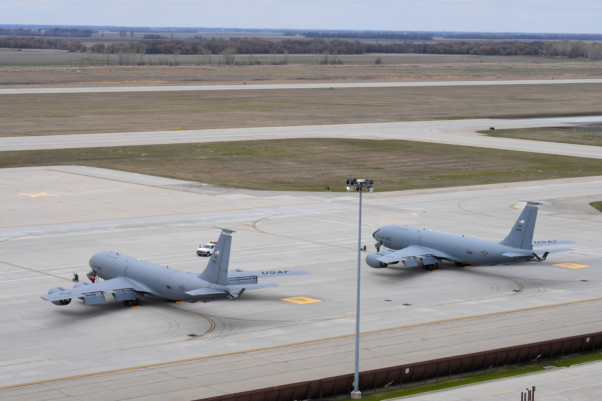 Two KC-135 Stratotankers, assigned to the 22nd Refueling Wing, receive routine maintenance after arriving May 6, 2019, to Grand Forks Air Force Base, North Dakota. McConnel AFB, Kansas, operates and maintains 37 KC-135’s, several of which were temporarily housed at Grand Forks AFB during a bout of inclement weather throughout Kansas. (U.S. Air Force photo by Senior Airman Elora J. Martinez)