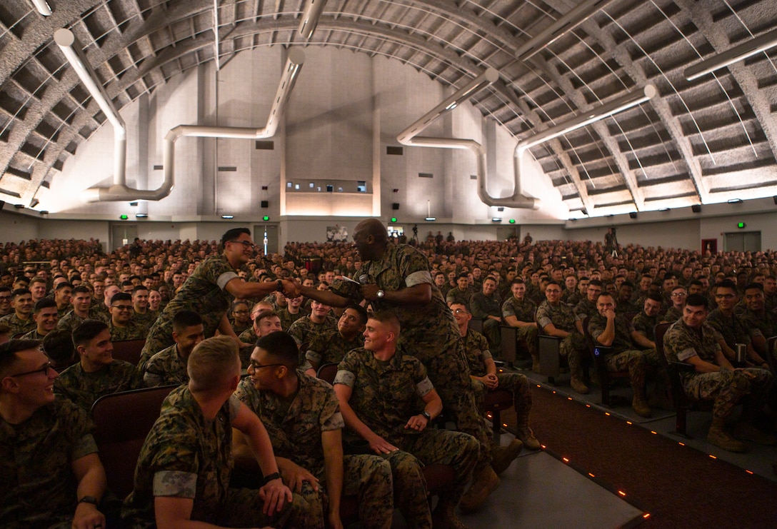 Sgt. Maj. Ronald L. Green, Sergeant Major of the Marine Corps, shakes a Marine’s hand during a town hall meeting at the Bob Hope Theater on Marine Corps Air Station Miramar, Calif., May 8. Green spoke before Gen. Robert B. Neller, Commandant of the Marine Corps, where they both provided information on current issues, spoke about the future of the Marine Corps and answered Marines’ questions during a town hall meeting. (U.S. Marine Corps photo by Sgt. Becky Cleveland)