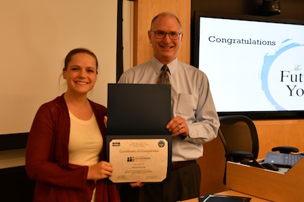 IMAGE: KING GEORGE, VA. (May 3, 2019) -- Gill Goddin, Naval Surface Warfare Center Dahlgren Division (NSWCDD) chief engineer, presents a certificate to a NSWCDD Leadership 101 graduate.