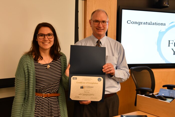 IMAGE: KING GEORGE, VA. (May 3, 2019) -- Gill Goddin, Naval Surface Warfare Center Dahlgren Division (NSWCDD) chief engineer, presents a certificate to a NSWCDD Leadership 101 graduate.