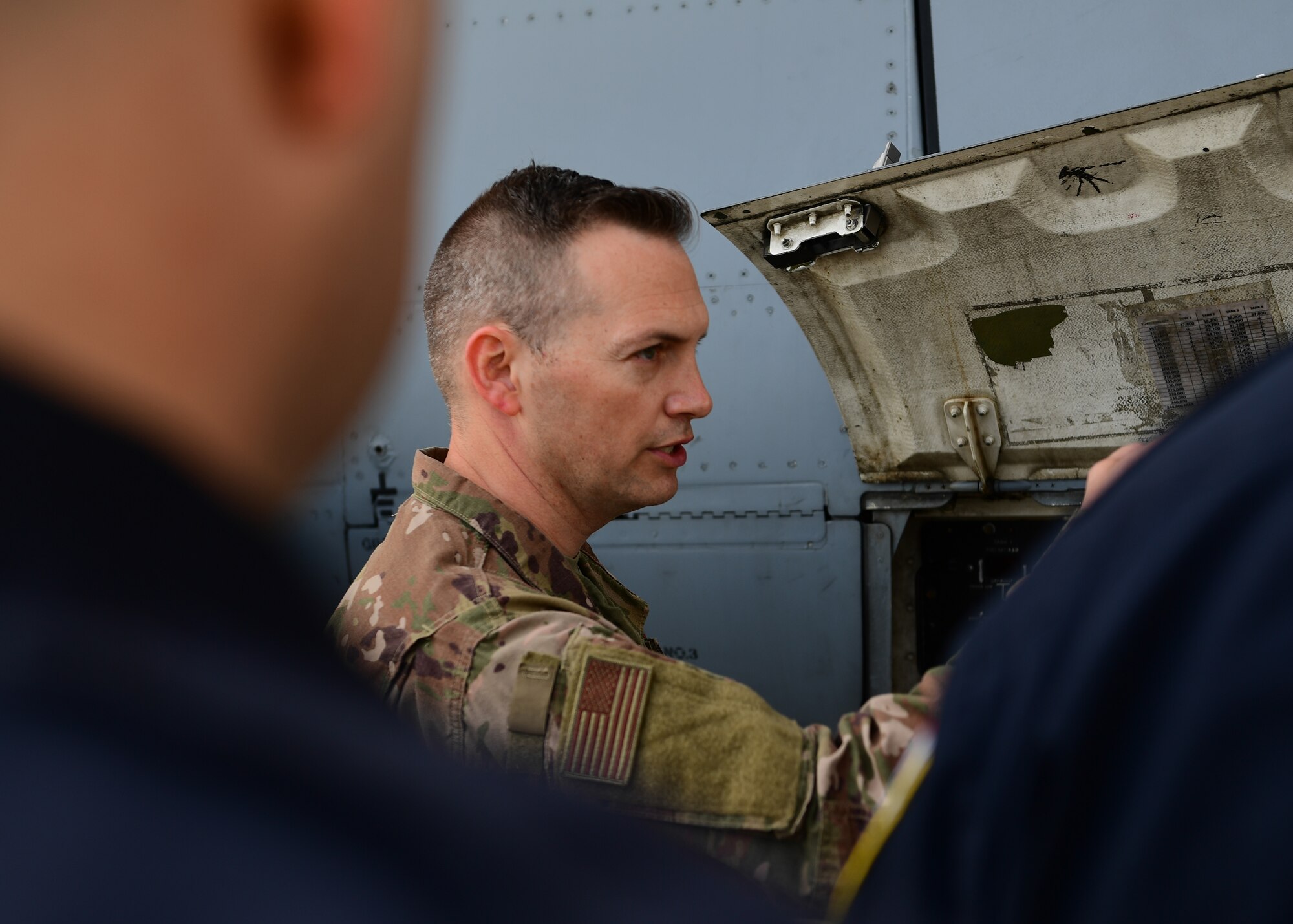 Tech. Sgt. Matthew Dillon, a crew chief with the 911th Aircraft Maintenance Squadron, teaches fire control techniques to the Allegheny County Airport Authority Fire Rescue team at the Pittsburgh International Airport Air Reserve Station, Pennsylvania, May 7, 2019. The firefighters needed to be trained on the C-17 Globemaster III due to the base conversion from C-130 Hercules aircraft. (U.S. Air Force Photo by Senior Airman Grace Thomson)