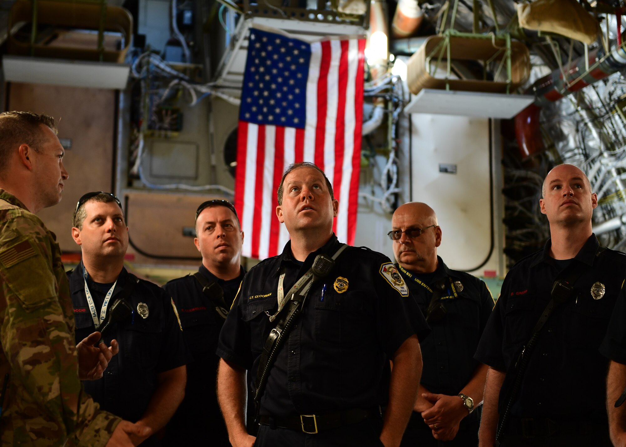 Members of the Allegheny County Airport Authority Fire Rescue team look around the cargo bay of a C-17 Globemaster III at the Pittsburgh International Airport Air Reserve Station, Pennsylvania, May 9, 2019. The 911th Airlift Wing ACAA-FR conducted joint training to familiarize the firefighters with the flash points and system procedures of the C-17. (U.S. Air Force Photo by Senior Airman Grace Thomson)