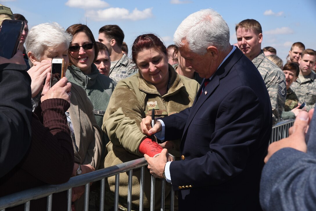 U.S. Vice President Mike Pence signs the cast of Tech. Sgt. Laura Taylor, of the 119th Security Forces Squadron, as he makes his way along a line of 119th Wing unit members and well-wishers upon arrival at the North Dakota Air National Guard Base, Fargo, N.D., May 9, 2019.