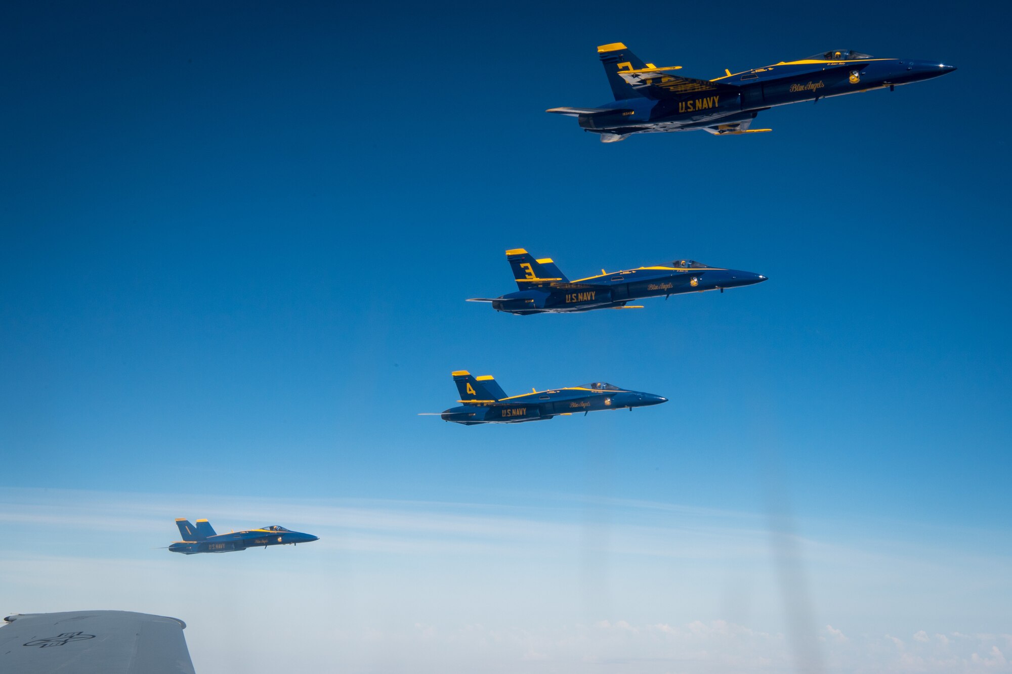 The U.S. Navy Flight Demonstration Squadron, the Blue Angels, fly in formation alongside a KC-10 Extender from the 78th Air Refueling Squadron, 514th Air Mobility Wing, Joint Base McGuire-Dix-Lakehurst, N.J., May 8, 2019. The 78th ARS provided centerline drogue air refueling for the Blue Angels on their way to Joint Base Andrews, Md. for an air show. (U.S. Air Force photo by Senior Airman Ruben Rios)