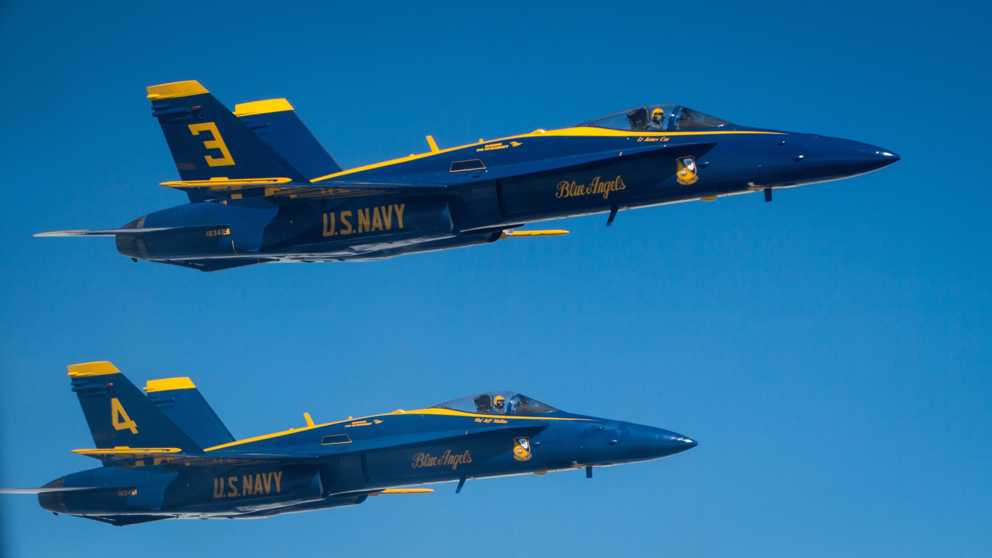 U.S. Navy Lt. James Cox and U.S. Marine Corp. Maj. Jeff Mullins, both pilots in the U.S. Navy Flight Demonstration Squadron, the Blue Angels, fly in formation alongside a KC-10 Extender from the 78th Air Refueling Squadron, 514th Air Mobility Wing, Joint Base McGuire-Dix-Lakehurst, N.J., May 8, 2019. The 78th ARS provided centerline drogue air refueling for the Blue Angels on their way to Joint Base Andrews, Md. for an air show. (U.S. Air Force photo by Senior Airman Ruben Rios)