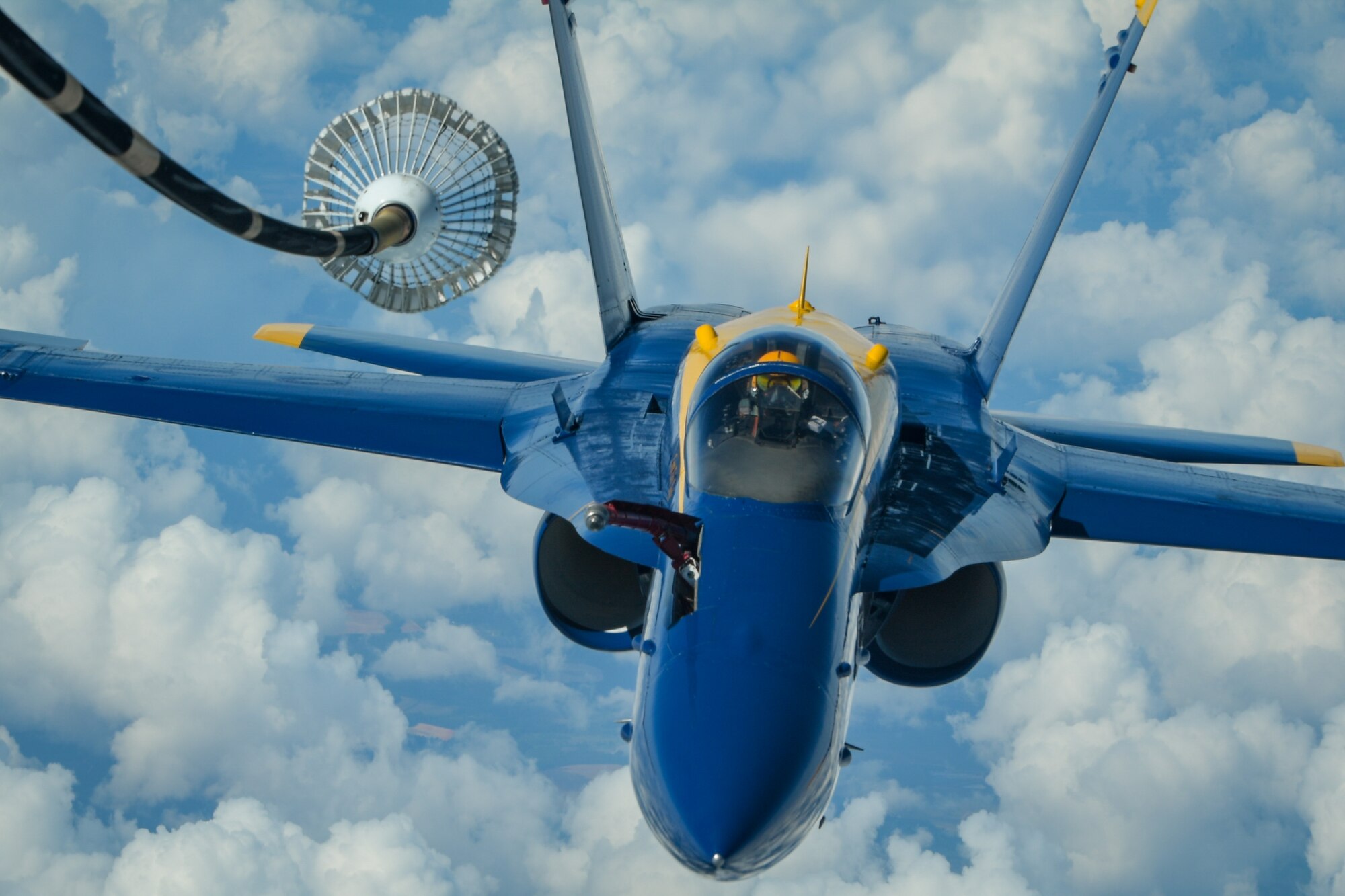 U.S. Navy Lt. James Cox, left wing pilot of the U.S. Navy Flight Demonstration Squadron, the Blue Angels, positions himself for centerline drogue air refueling from a KC-10 Extender flown by the 78th Air Refueling Squadron, 514th Air Mobility Wing, Joint Base McGuire-Dix-Lakehurst, N.J., May 8, 2019. The 78th ARS provided air refueling for the Blue Angels to move them to Joint Base Andrews, Md. for an air show. (U.S. Air Force photo by Senior Airman Ruben Rios)