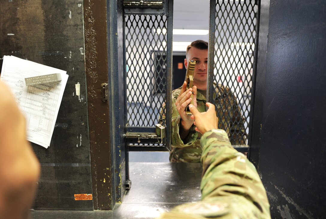 Staff Sgt. Zackery Waitkus and Airman 1st Class Malik Tyler, 341st Security Support Squadron armorers, demonstrate proper weapons return May 8, 2019, at Malmstrom Air Force Base, Mont.