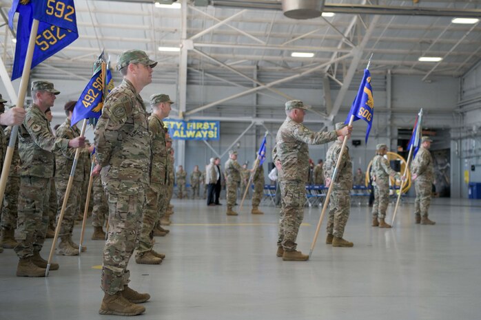 A group of people in a hangar.