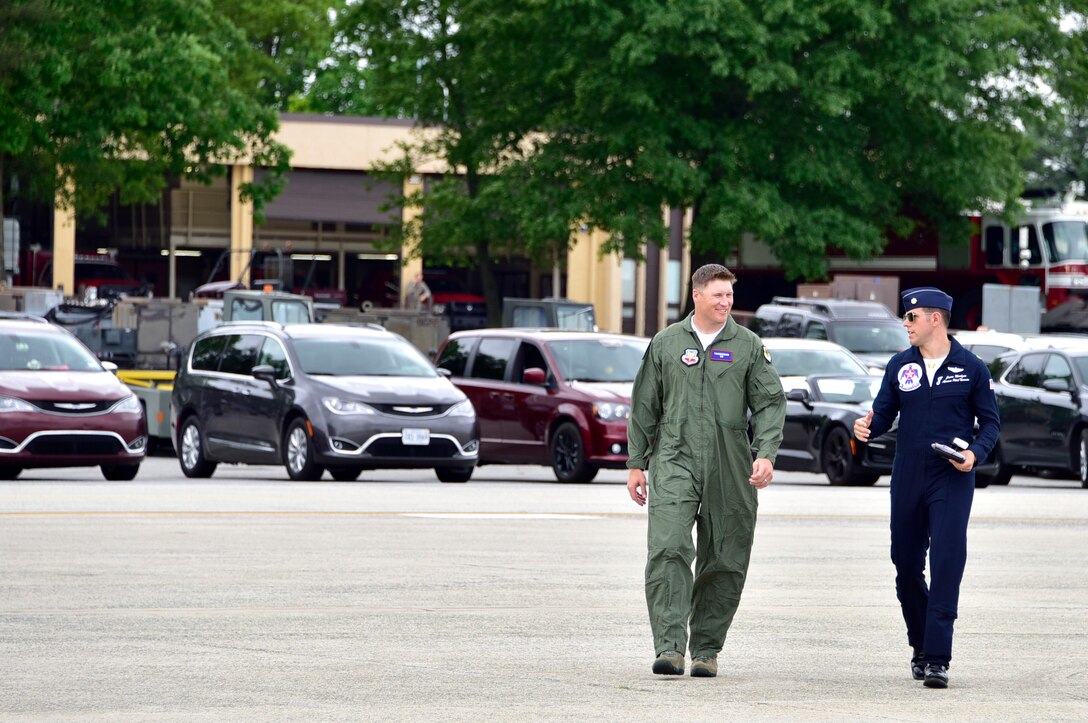 Maj. Jason Markzon, Advance Pilot/Narrator for the U.S. Air Force Demonstration Squadron “Thunderbirds”, right, walks with Todd Heap, former tight end for the Baltimore Ravens, on Joint Base Andrews, Md. May 9, 2019. After arriving at JBA, the Thunderbirds met with Heap and practiced their performance in preparation for the 2019 JBA Legends in Flight Air & Space Expo. (U.S. Air Force photo by Airman 1st Class Noah Sudolcan)