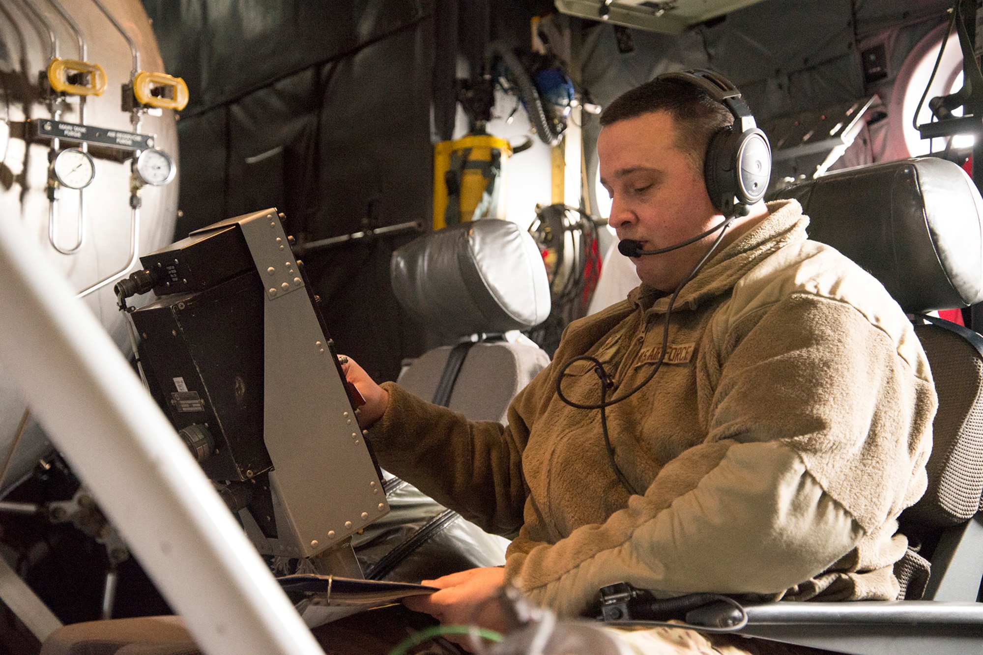 Master Sgt. Jason Harvey, a 731st Airlift Squadron Modular Airborne Fire Fighting System instructor loadmaster, checks over the MAFFS checklist, May 9, 2019, at Peterson Air Force Base, Colorado.