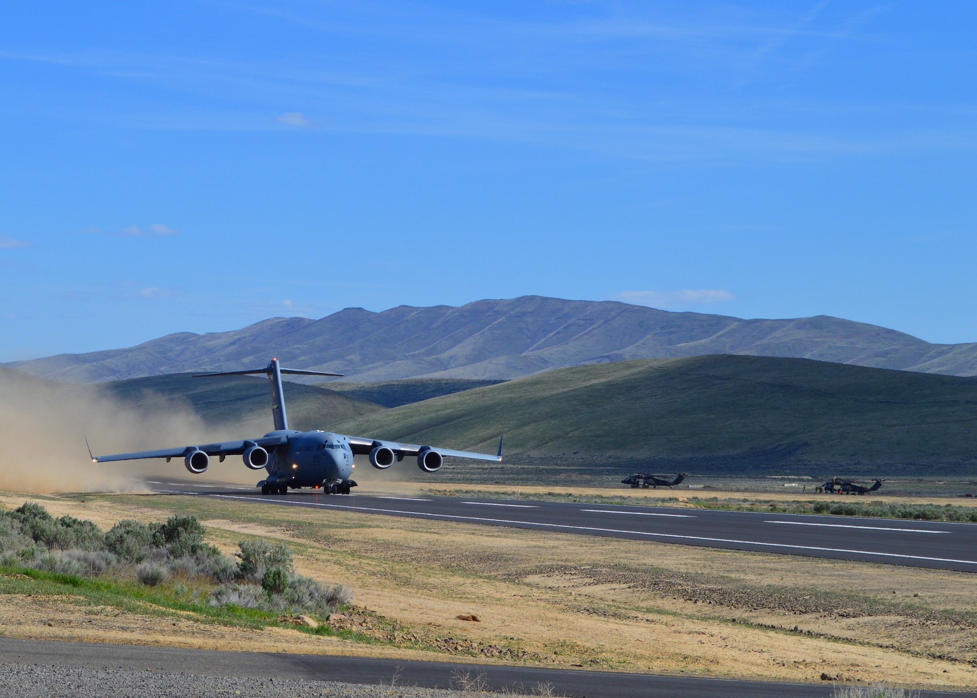 C-17 Globemaster III assigned to McChord Field takes off from Selah airstrip at Yakima Training Center May 1, 2019. Reserve Citizen Airmen from the 446th Airlift Wing delivered two Army UH-60 Black Hawk helicopters during a readiness exercise. It was the first time Reserve Citizen Airmen utilized the newly refurbished runway.