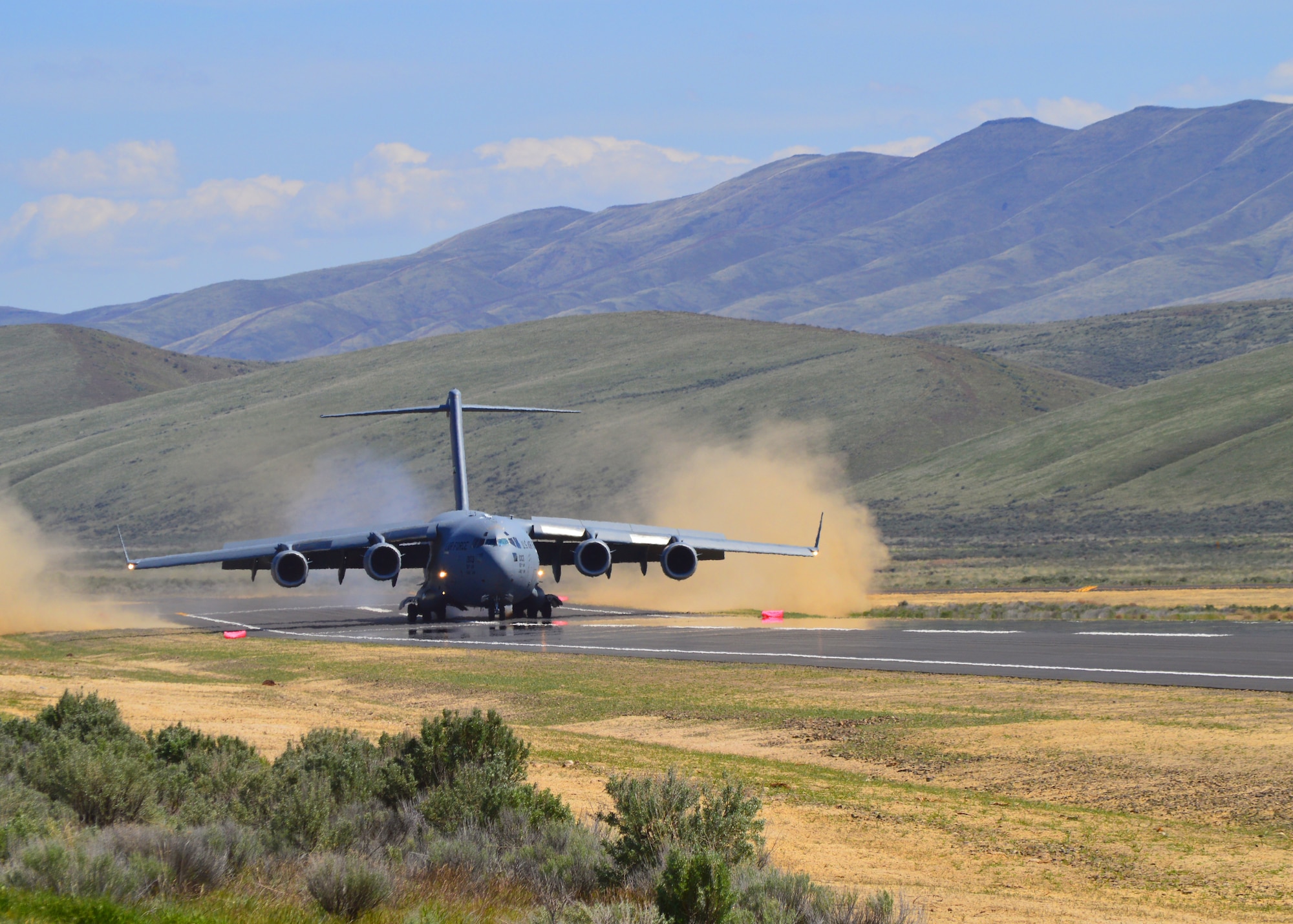A C-17 Globemaster III piloted by a 446th Airlift Wing aircrew lands for the first time at the Selah airstrip May 1, 2019.
