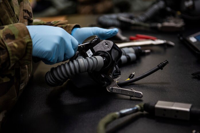 U.S. Air Force Staff Sgt. Vanessa Roper, 8th Operations Support Squadron aircrew flight equipment journeyman at the 35th Fighter Squadron “Pantons,” performs maintenance on a pilot’s oxygen mask at Kunsan Air Base, Republic of Korea, April 29, 2019. AFE is responsible for the maintenance and repair of a pilot’s gear and survival equipment. (U.S. Air Force photo by Senior Airman Stefan Alvarez)