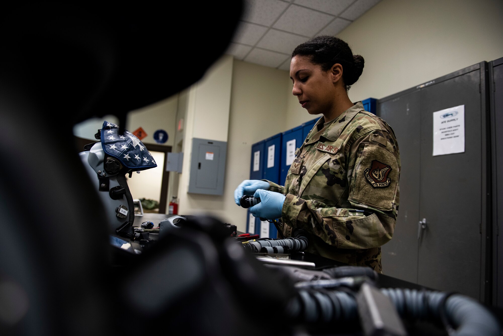 U.S. Air Force Staff Sgt. Vanessa Roper, 8th Operations Support Squadron aircrew flight equipment journeyman at the 35th Fighter Squadron “Pantons,” performs maintenance on a component of a pilot’s helmet at Kunsan Air Base, Republic of Korea, April 29, 2019. Everything a pilot needs to fly and survive in emergencies, from his helmet to ejection seat parachute, is maintained and prepared by AFE airmen. (U.S. Air Force photo by Senior Airman Stefan Alvarez)