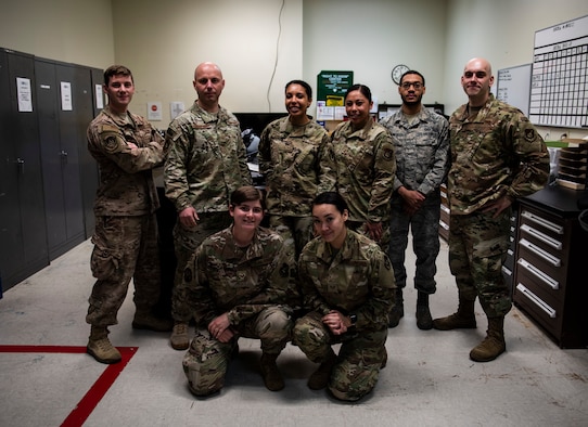 Members of the 8th Operations Support Squadron aircrew flight equipment flight from the 35th and 80th Fighter Squadrons pose for a photo at Kunsan Air Base, Republic of Korea, April 29, 2019. The 8th OSS AFE flight is split up in two different fighter squadrons, but will work together when manning is low due to TDYs or deployments to keep the mission going. (U.S. Air Force photo by Senior Airman Stefan Alvarez)