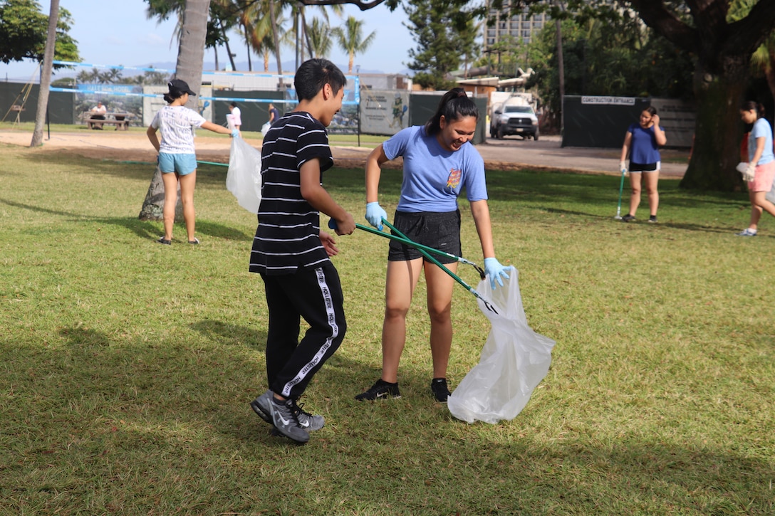 HONOLULU, Hawaii (April 27, 2019) -- Punahou School Junior ROTC cadet volunteers pick-up trash in the Fort DeRussy beach park area as part of the Corps' Earth Day 2019 clean-up event. The 2019 U.S. Army Earth Day theme is “Sustain the Environment to Secure the Mission.” This was the 14th consecutive year Honolulu District has held the Earth Day event at the U.S. Army Corps of Engineers Pacific Regional Visitor Center at Battery Randolph on Fort DeRussy.