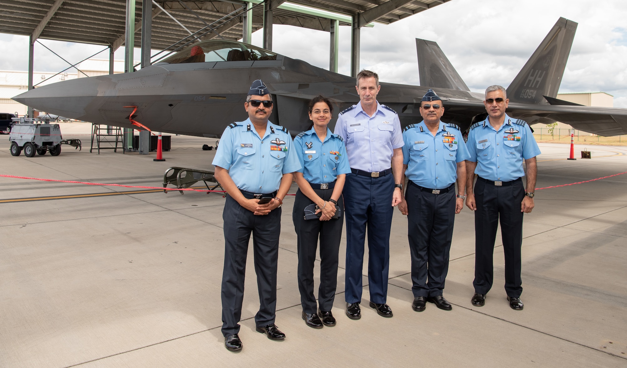 United States Air Force Lt. Gen. Kevin B. Schneider, 5th Air Force Commander, poses for a photo in front of an F-22 Raptor at Joint Base Pearl Harbor-Hickam with Indian Air Force attendees of the India Executive Steering Group, May 3, 2019. This year marks the 22nd iteration of the steering group between the two nations and is the primary venue for determining future engagements between the two air forces. (U.S. Air Force Photo by Staff Sgt. Daniel Robles)