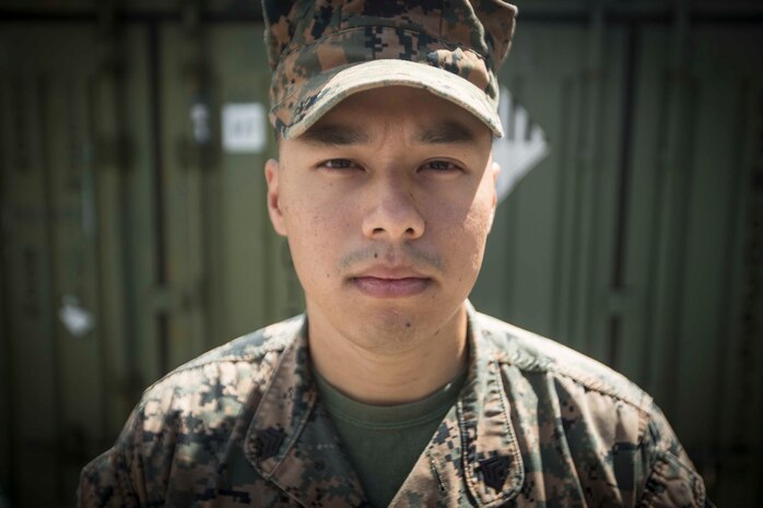 Sgt. Jimmy Siackasone, a defense cyberspace operator with S-6, Command Element, 31st Marine Expeditionary Unit, stands outside the 31st MEU S-6 compound on Camp Hansen, Okinawa, Japan, April 18, 2019.