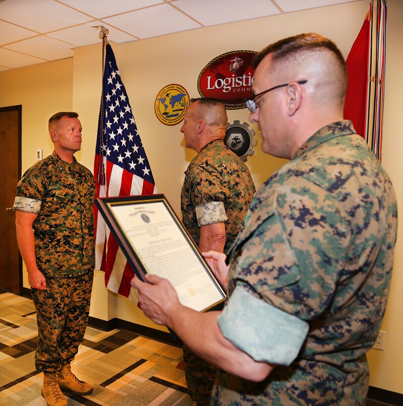 Brig. Gen. Joseph F. Shrader, commanding general, Marine Corps Logistics Command, stands at attention in front of Lt. Gen. Charles G. Chiarotti, deputy commandant, Installations and Logistics, Headquarters Marine Corps, while MARCORLGOCOM's Sgt. Maj. Michael Rowan reads Shrader's promotion warrant. 

Shrader was promoted to the rank of major general during a ceremony held May 8 at the MARCORLOGCOM Headquarters aboard Marine Corps Logistics Base Albany, Ga.