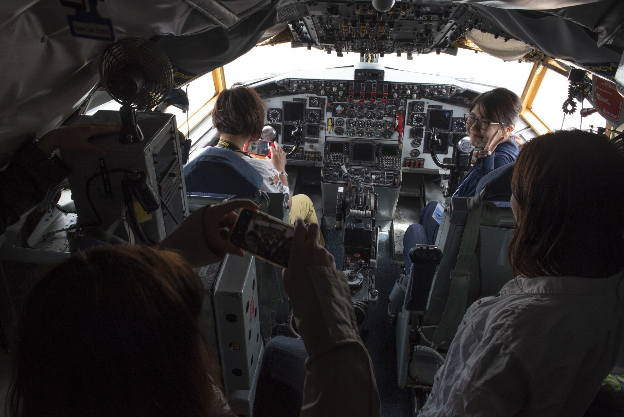 Tour participants view the cockpit of a KC-135 Stratotanker during a base tour of Kadena Air Base, Japan, May 8, 2019. The participants received a base mission brief and F-15 Eagle static display at Naha Air Base before traveling to Kadena for an 18th Wing mission brief and KC-135 Stratotanker static display. (U.S. Air Force photo by Tech. Sgt. Matthew B. Fredericks)