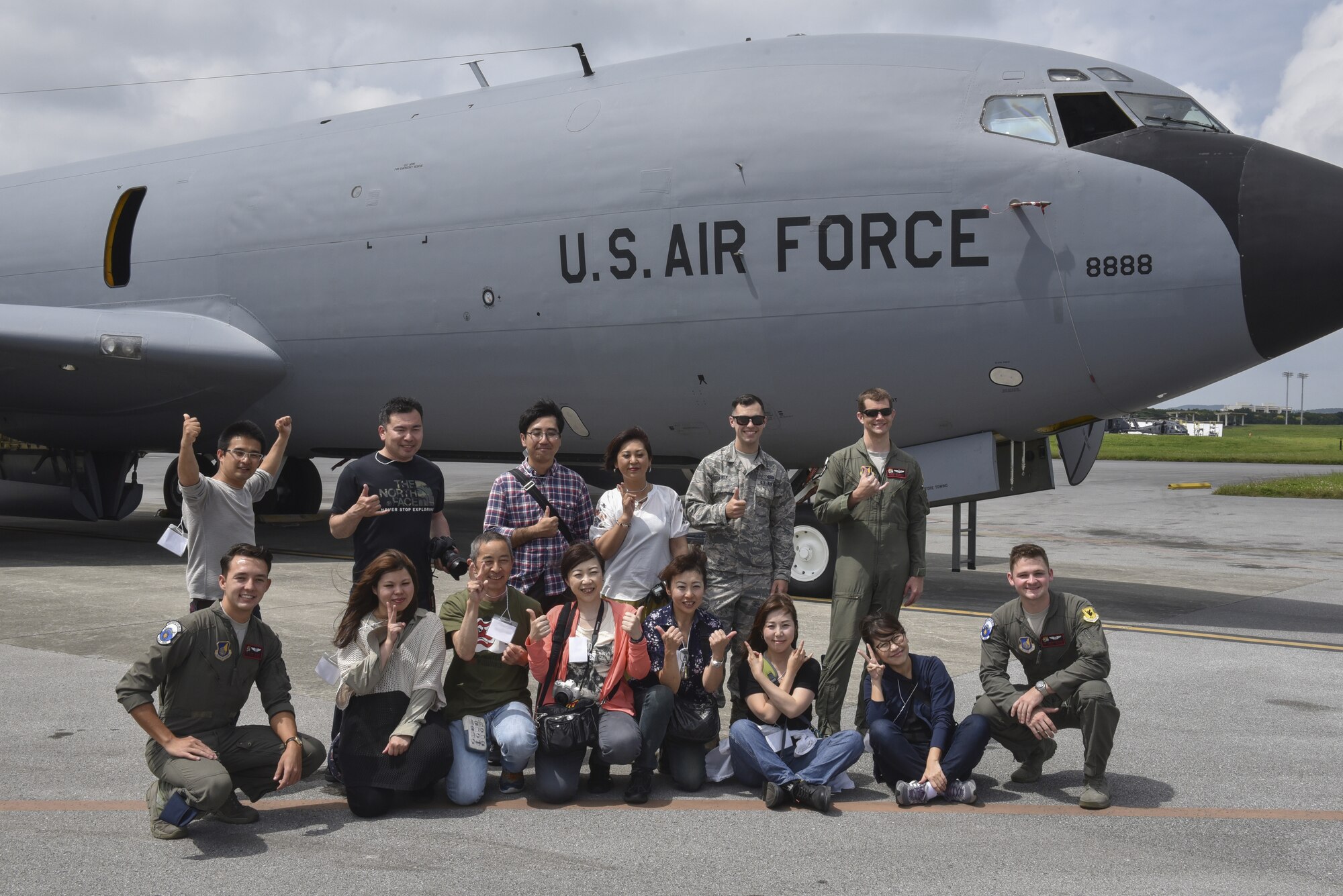 Tour participants pose for a group photo during a base tour of Kadena Air Base, Japan, May 8, 2019. The participants received a base mission brief and F-15 Eagle static display at Naha Air Base before traveling to Kadena for an 18th Wing mission brief and KC-135 Stratotanker static display. (U.S. Air Force photo by Tech. Sgt. Matthew B. Fredericks)