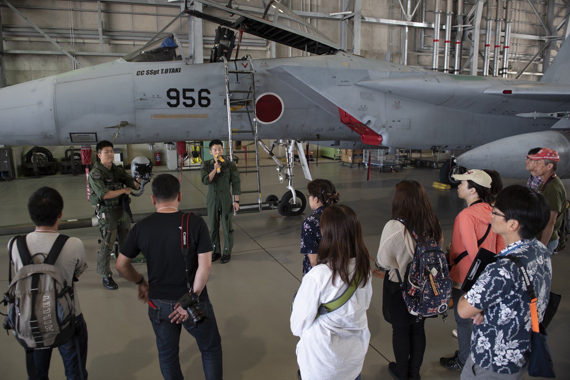 Japan Air Self-Defense Force pilots brief tour participants during a base tour of Naha Air Base, Japan, May 8, 2019. The participants received a base mission brief and F-15 Eagle static display before traveling to Kadena Air Base for an 18th Wing mission brief and KC-135 stratotanker static display. (U.S. Air Force photo by Tech. Sgt. Matthew B. Fredericks)