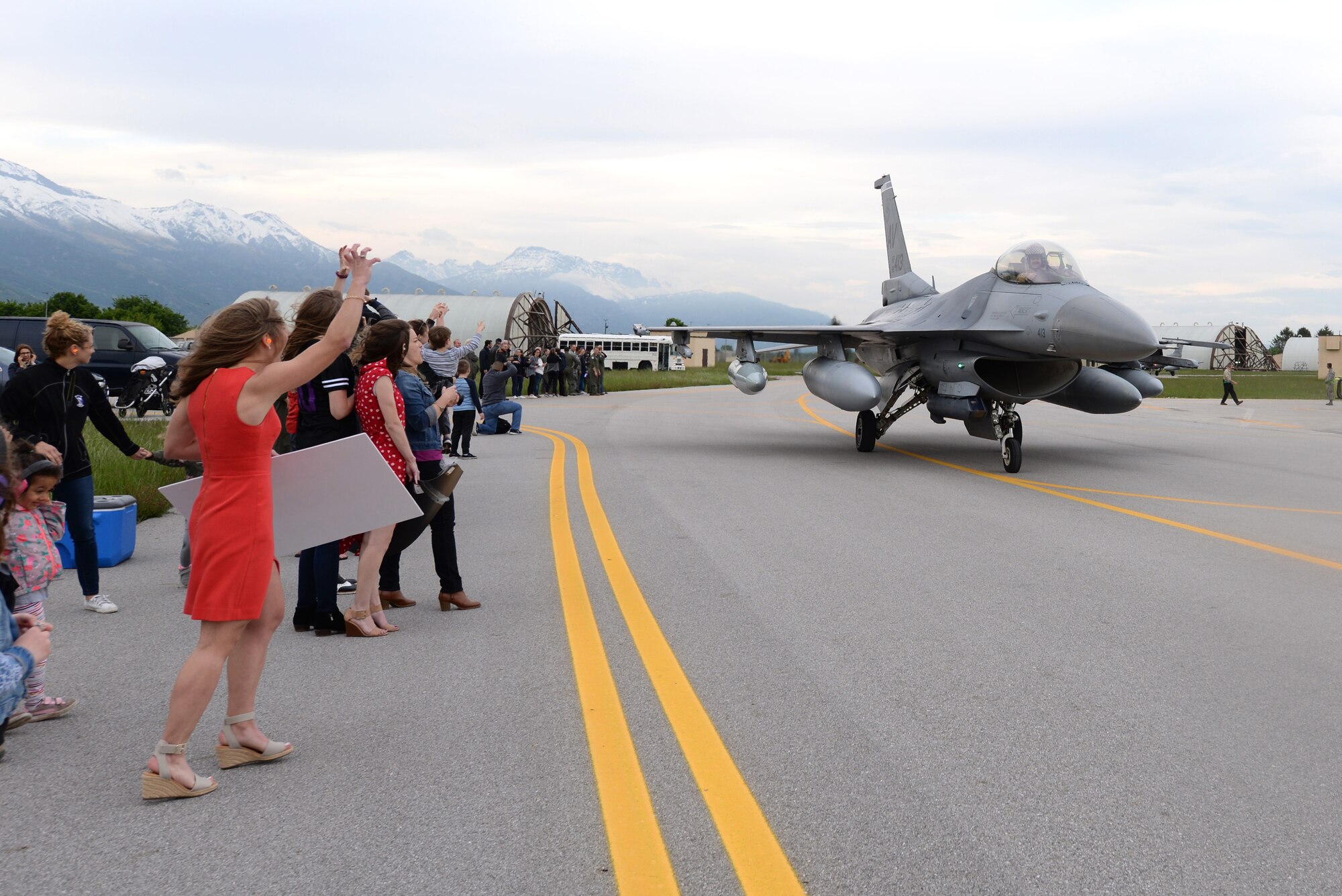 Families welcome back Airmen from the 510th Fighter Squadron at Aviano Air Base, Italy, April 30, 2019. 510th FS Airmen were deployed to Bagram Air Field, Afghanistan, where they flew 7,500 combat hours and executed more than 1,000 sorties to deter adversaries and execute the National Defense Strategy. (U.S. Air Force photo by Senior Airman Kevin Sommer Giron)