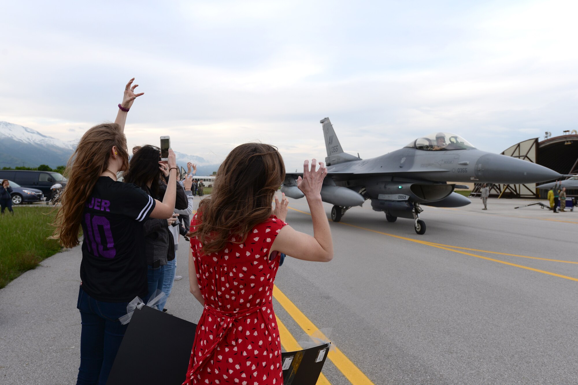 Families greet Airmen from the 510th Fighter Squadron arriving at Aviano Air Base, Italy, April 30, 2019.  510th FS Airmen were deployed to Bagram Air Field, Afghanistan, where they flew 7,500 combat hours and executed more than 1,000 sorties to deter adversaries and execute the National Defense Strategy. (U.S. Air Force photo by Senior Airman Kevin Sommer Giron)