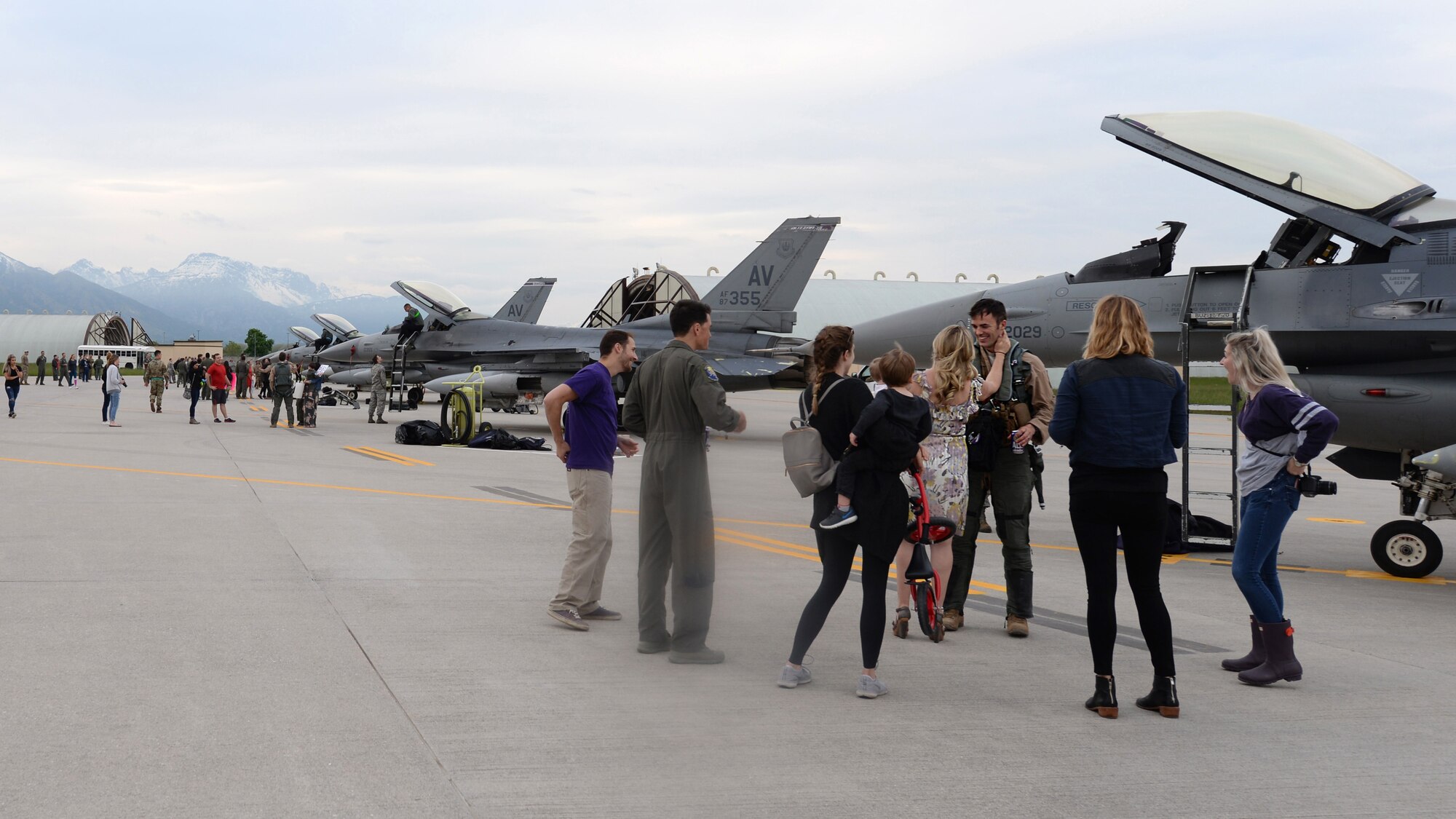 Previously deployed 510th Fighter Squadron Airmen are greeted by their families at Aviano Air Base, Italy, April 30, 2019. The Airman and Family Readiness Center provided various support programs for families of deployed members, including monthly family dinners. (U.S. Air Force photo by Senior Airman Kevin Sommer Giron)