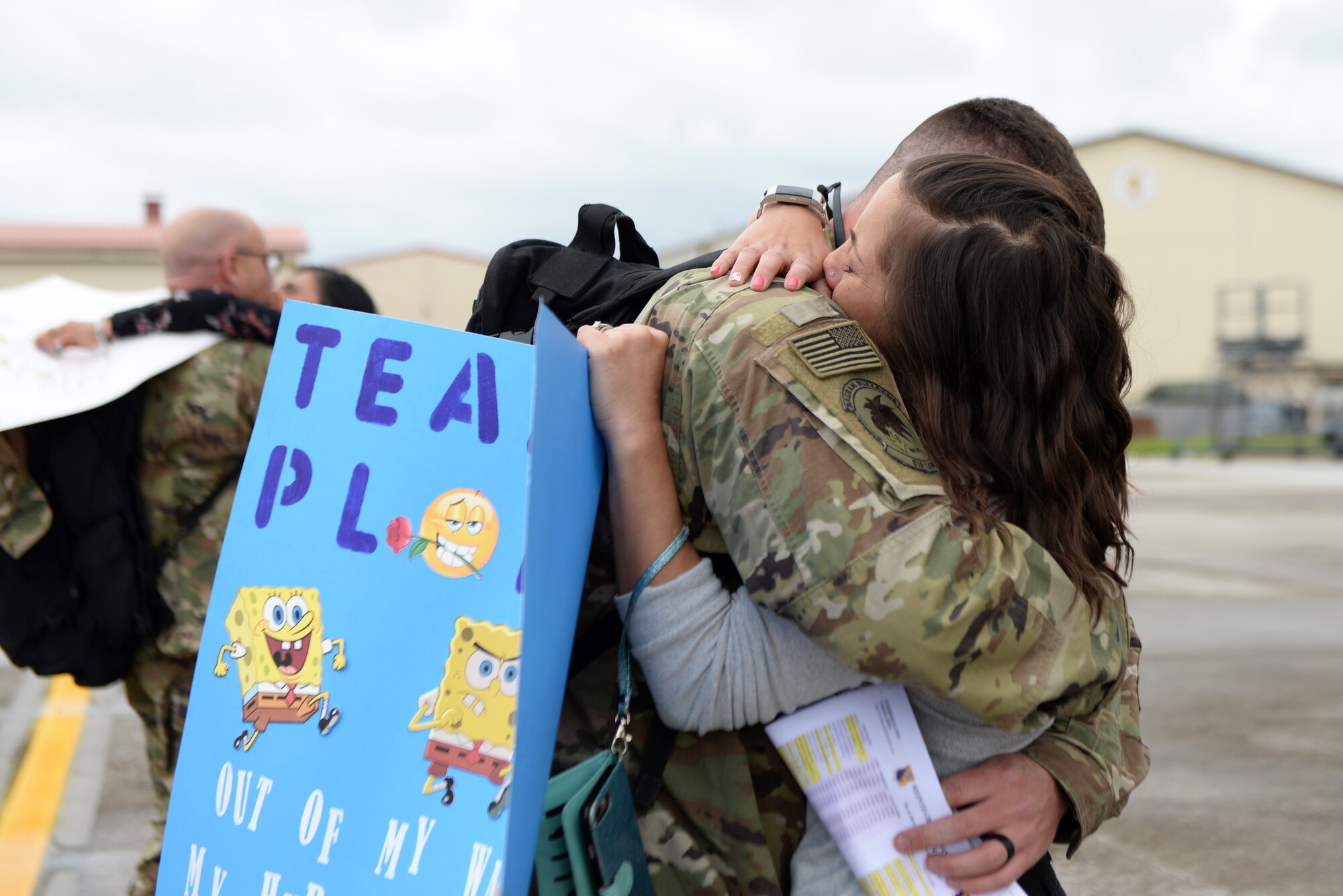 A 31st Fighter Wing Airman returns home from a deployment and embraces his spouse at Aviano Air Base, Italy, May 9, 2019. The Airman and Family Readiness Center provided various support programs for families of deployed members, including monthly family dinners. (U.S. Air Force photo by Senior Airman Kevin Sommer Giron)