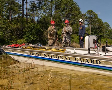 A task force team comprised of Florida National Guardsmen and civilian first responders rehearse a maritime rescue at Kingsley Lake on Camp Blanding Joint Training Center as part of the annual Search and Rescue Exercise.