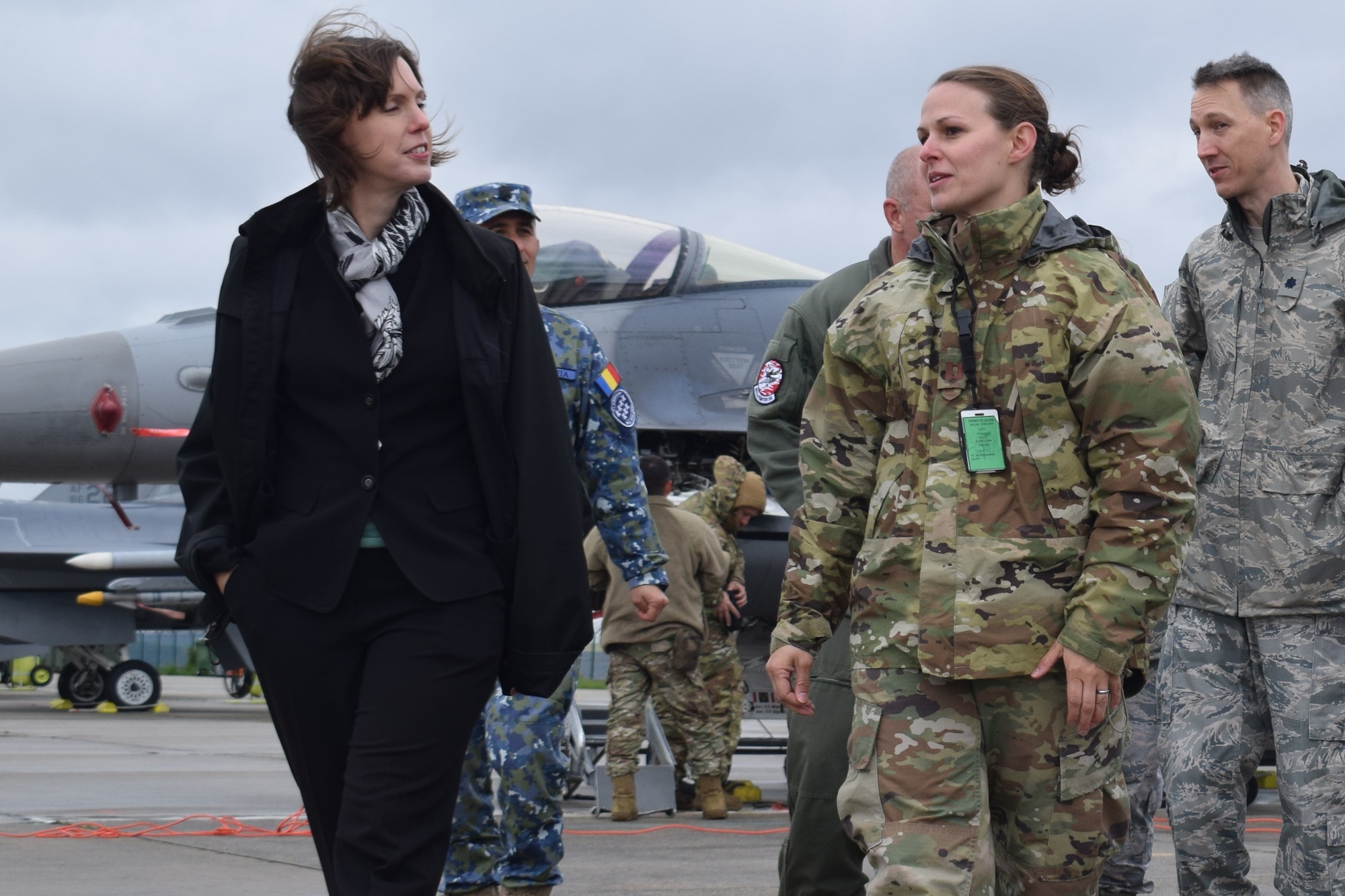 Ms. Abigail Rupp, deputy chief of mission, U.S. Embassy - Bucharest, Romania, visits with U.S. Air Force Airmen assigned the 301st Fighter Wing, Joint Reserve Base Fort Worth, Texas, supporting Theater Security Package 19.1 at Campia Turzii, Romania, May 7, 2019. Funded through the European Deterrence Initiative, TSP 19.1 provides a more robust U.S. military rotational presence in the European theater, capable of deterring, and if required, responding to regional threats. While in theater, these personnel and aircraft will participate in multiple readiness exercises alongside NATO allies and partners to strengthen interoperability and to demonstrate U.S. commitment to the stability and security of Europe (U.S. Air Force photo by 1st Lt. Andrew Layton).