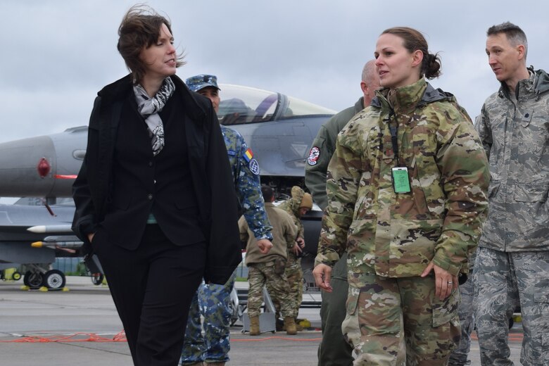 Ms. Abigail Rupp, deputy chief of mission, U.S. Embassy - Bucharest, Romania, visits with U.S. Air Force Airmen assigned the 301st Fighter Wing, Joint Reserve Base Fort Worth, Texas, supporting Theater Security Package 19.1 at Campia Turzii, Romania, May 7, 2019. Funded through the European Deterrence Initiative, TSP 19.1 provides a more robust U.S. military rotational presence in the European theater, capable of deterring, and if required, responding to regional threats. While in theater, these personnel and aircraft will participate in multiple readiness exercises alongside NATO allies and partners to strengthen interoperability and to demonstrate U.S. commitment to the stability and security of Europe (U.S. Air Force photo by 1st Lt. Andrew Layton).