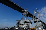 The Nimitz-class aircraft carrier USS Abraham Lincoln (CVN72) sails under the Peace Bridge while transiting the Suez Canal. The Abraham Lincoln Carrier Strike Group (ABECSG) is deployed to U.S. Central Command area of responsibility in order to defend American forces and interests in the region. With Abraham Lincoln as the flagship, deployed strike group assets include staffs, ships and aircraft of Carrier Strike Group 12 (CSG 12), Destroyer Squadron 2 (DESRON 2), USS Leyte Gulf (CG 55) and Carrier Air Wing 7 (CVW 7); as well as the Spanish navy �lvaro de Baz�n-class frigate ESPS M�ndez N��ez (F 104). (U.S. Navy photo by Mass Communication Specialist 1st Class Brian M. Wilbur/Released)