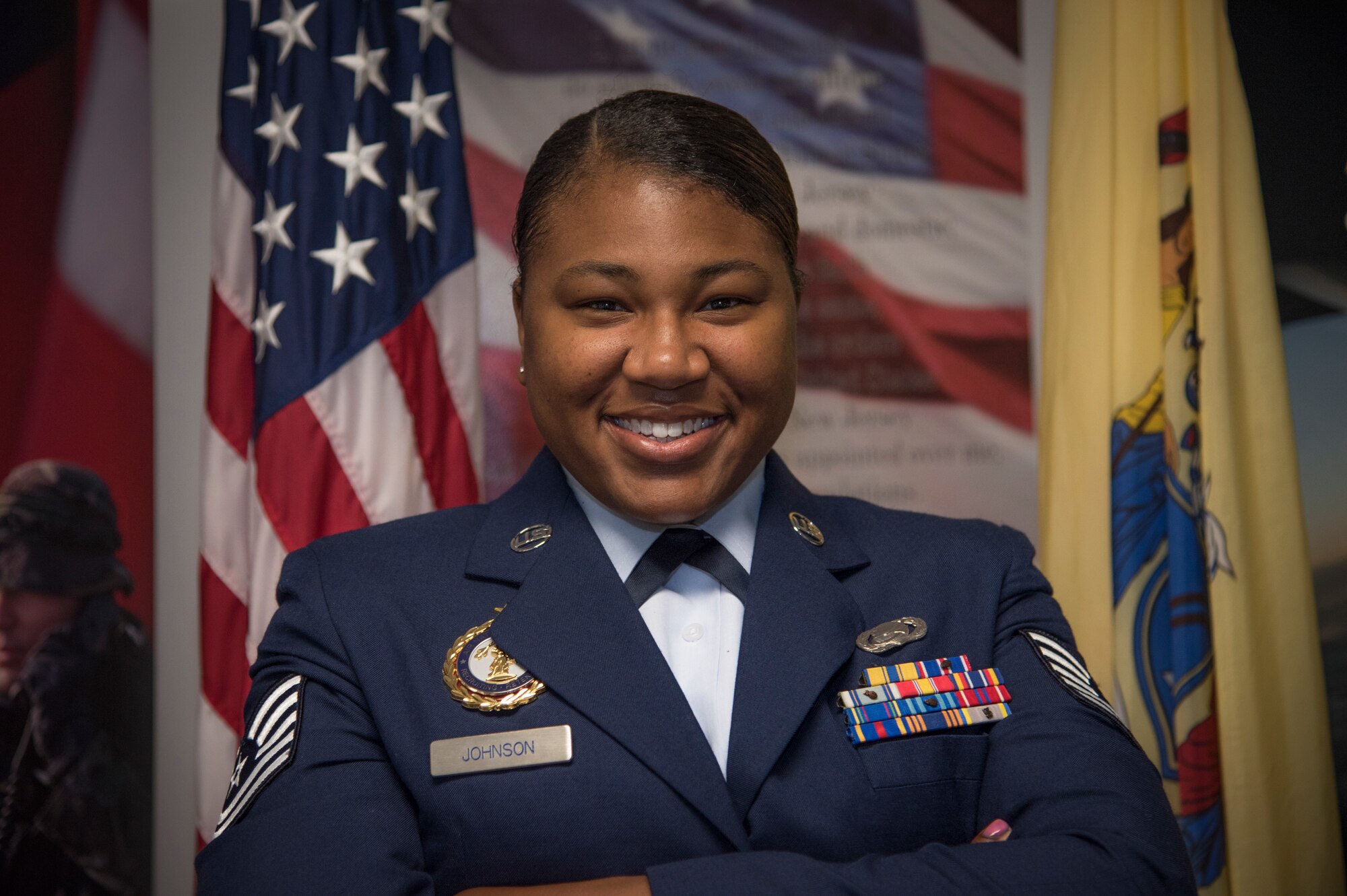 Tech Sgt. Jazlyn L. Johnson, a production recruiter of the 108th wing, poses for a photo at Joint Base McGuire-Dix-Lakehurst, N.J., May 2, 2019. Johnson was honored by thhe National Guard Bureau and inducted into their 100th Century Club for enlisting her 100th member into the Air National Guard. (U.S. Air National Guard photo by Airman 1st Class Andrea A. S. Williamson)