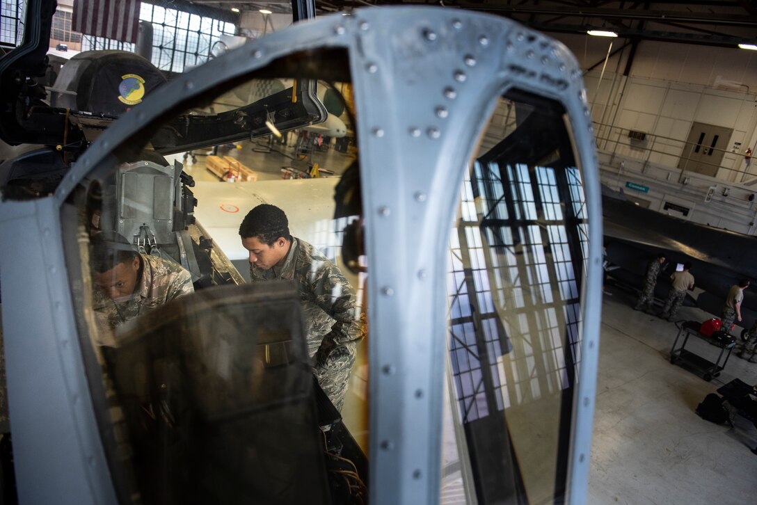 Airman Jessiah Martin, left, and Airman Jon Charles William, 365th Training Squadron A-10 avionics apprentice course student, remove the display in the flightdeck of an A-10 Thunderbolt II while  at Sheppard Air Force Base, Texas, May 9, 2019. Martin will remove and replace the display as part of his hands-on training. Avionic technicians maintain most instruments in the flightdeck including indicators, displays, communications and more. (U.S. Air Force photo by Airman 1st Class Pedro Tenorio)