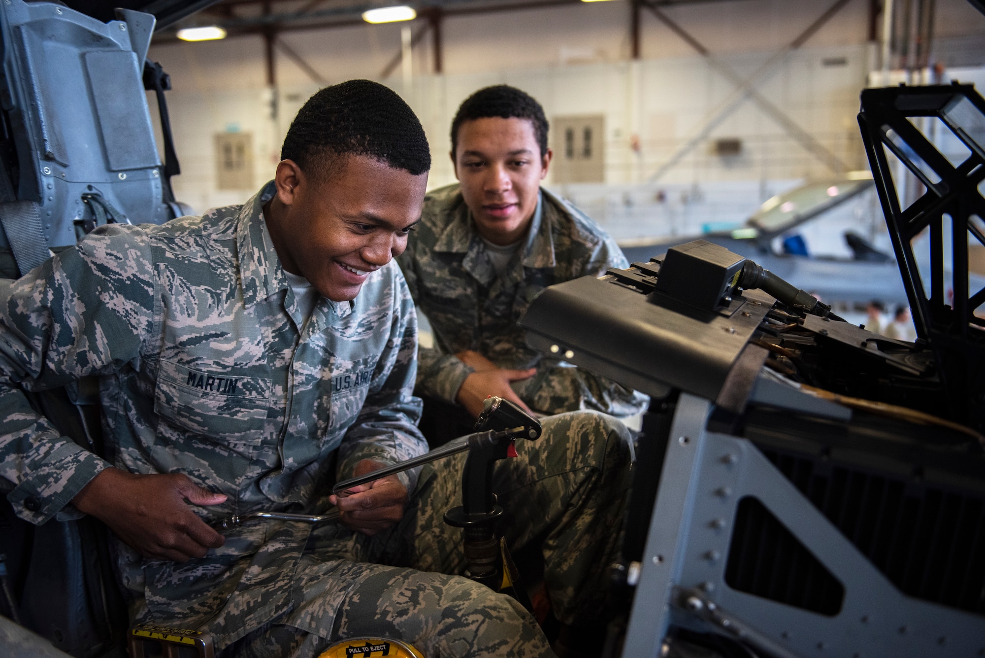 Airman Jessiah Martin,  365th Training Squadron A-10 avionics apprentice course student, removes the display in the flightdeck of an A-10 Thunderbolt II while Airman Jon Charles William watches at Sheppard Air Force Base, Texas, May 9, 2019. Martin will remove and replace the display as part of his hands-on training. Avionic technicians maintain most instruments in the flightdeck including indicators, displays, communications and more. (U.S. Air Force photo by Airman 1st Class Pedro Tenorio)