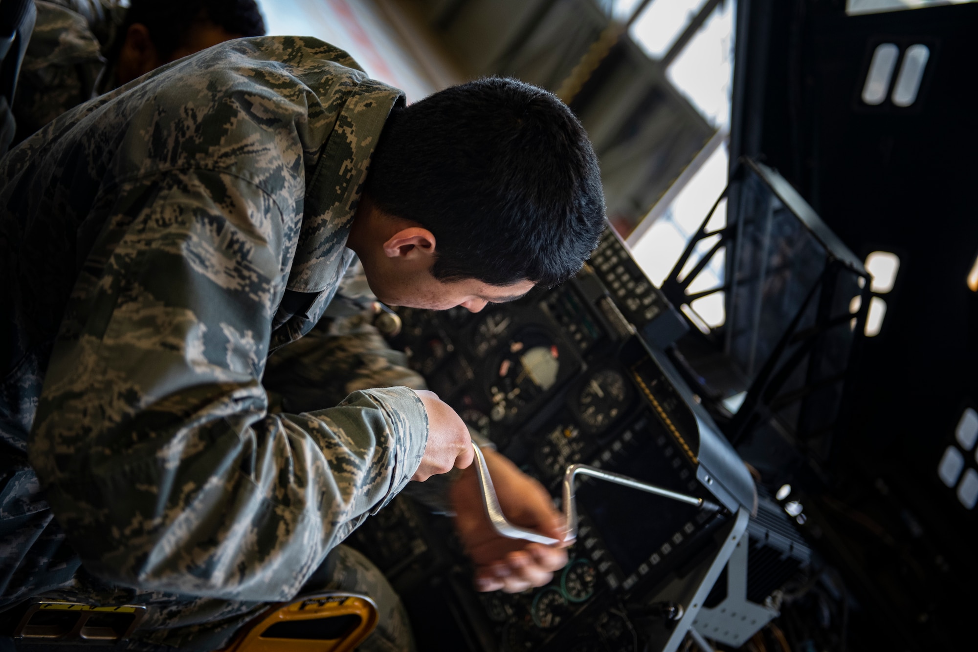 Airman Andres Cervera, 365th Training Squadron A-10 avionics apprentice course student, removes the display in the flightdeck of an A-10 Thunderbolt II at Sheppard Air Force Base, Texas, May 9, 2019. Cervera will remove and replace the display as part of his hands-on training. Avionics maintains most instruments in the flightdeck including indicators, displays, communications and more. (U.S. Air Force photo by Airman 1st Class Pedro Tenorio)