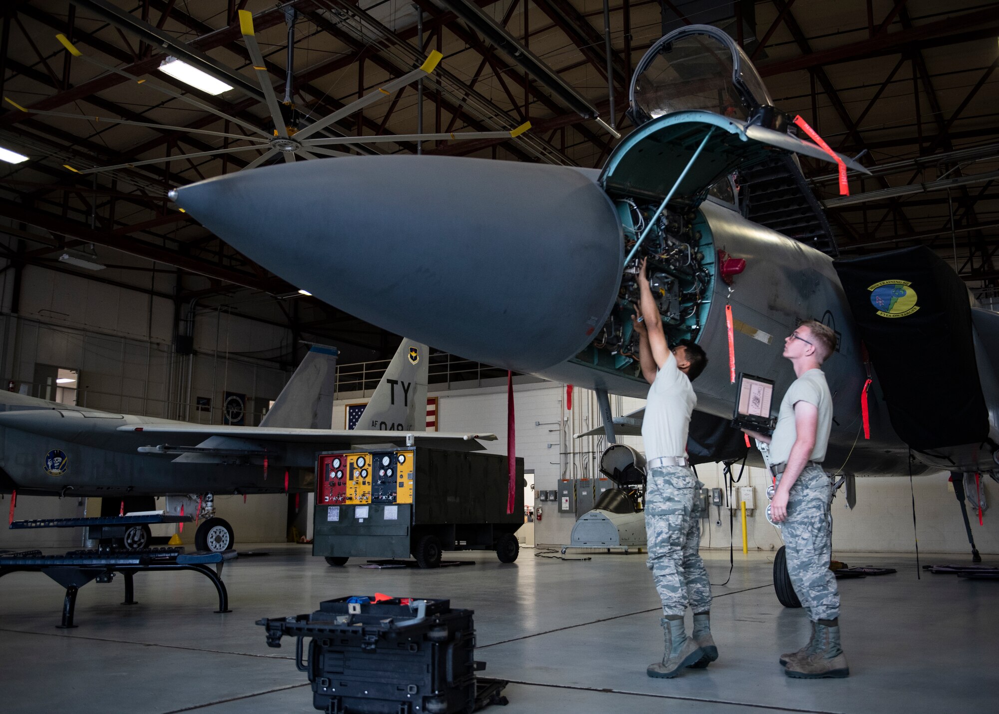 Airman Aristotle Ordinario, left, and Airman 1st Class Patrick Cochran, 365th Training Squadron F-15 avionics apprentice course students, remove and replace an F-15 Eagle's radar at Sheppard Air Force Base, Texas, May 9, 2019. Besides the radar, avionics technicians are also responsible in maintaining the aircraft's communications, navigation systems, flight controls and more. (U.S. Air Force photo by Airman 1st Class Pedro Tenorio)