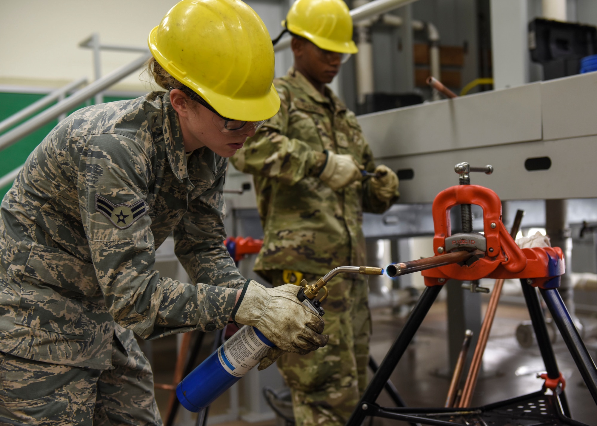 U.S. Air Force Airman 1st Class Baylee Howell and U.S. Army Private 2nd Class, 366th Training Squadron water and fuels systems maintenance apprentice course students, prepare pieces of copper for soldering at Sheppard Air Force Base, Texas, May 8, 2019. During this course, students learn about the processes of hot water distribution and interior plumbing. Upon graduation, students will have acquired a skillset that will allow for them to execute interior plumbing around an installation. (U.S. Air Force photo by Senior Airman Ilyana A. Escalona)