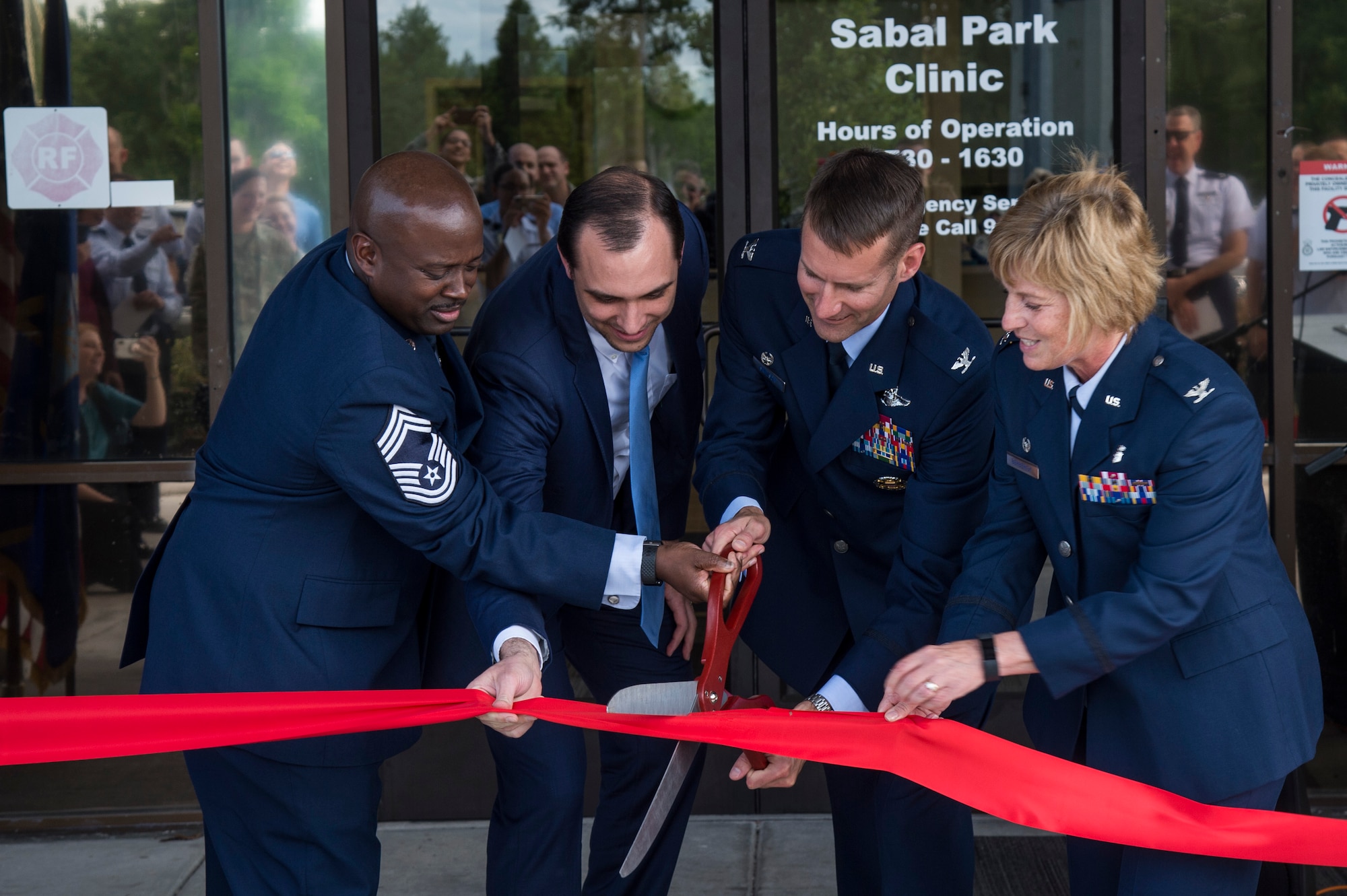 MacDill Air Force Base leadership cut the ribbon during the Sabal Park Clinic opening ceremony in Tampa, Fla., May 3, 2019.