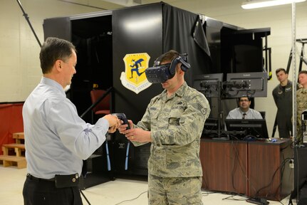 Bill Ehler, Capewell Aerial Systems business development manager, left, provides instruction on the virtual loadmaster training system (VLTS) to Staff Sgt. Chad Warren March 29, 2019 at Bradley Air National Guard Base, Conn. The development of this first-of-its-kind training system was a collaborative effort between the 103rd Airlift Wing and Capewell Aerial Systems.