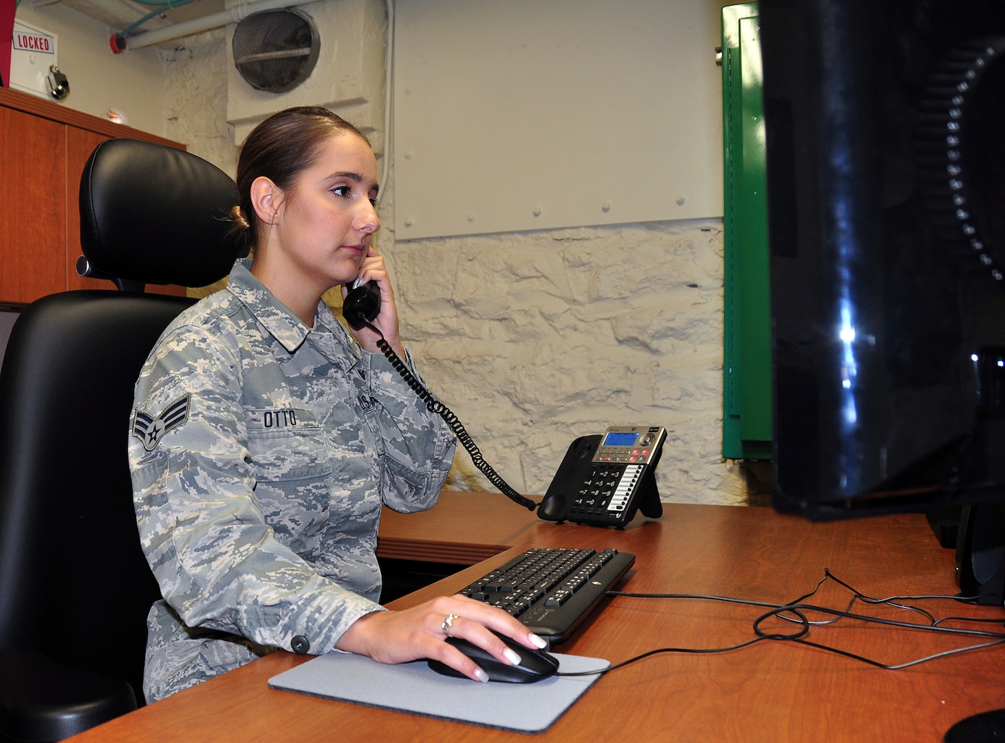 Senior Airman Danielle Otto, senior emergency actions controller, receives a call while on duty, April 25,2019, Joint Base San Antonio-Fort Sam Houston, Texas. Otto is the 2018 Command Post Airman of the Year for Air Education and Training Command.